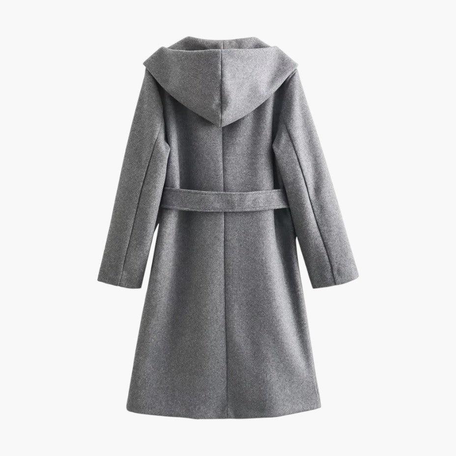 Stylish women's hooded rain jacket, offering weather protection with a chic belted design.