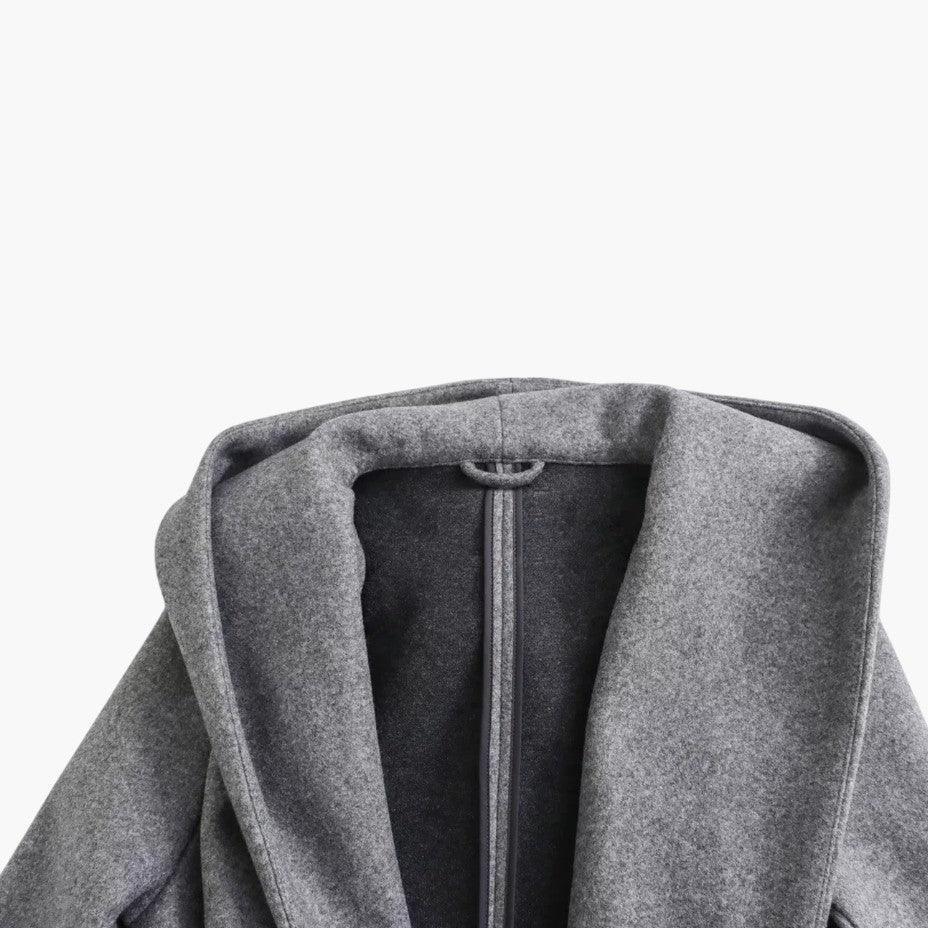 Elegant women's trench coat, featuring a protective hood, button-front, and flattering belt.