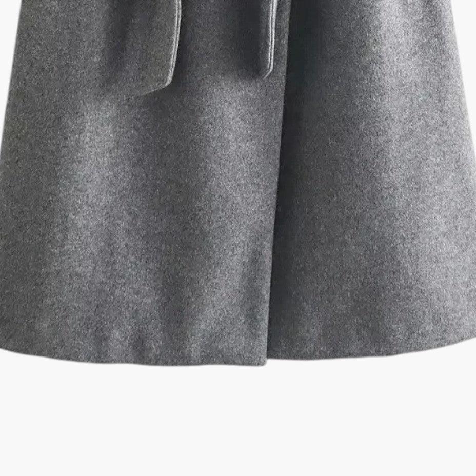 Fashionable women's spring coat: a hooded, belted trench for stylish weather protection.