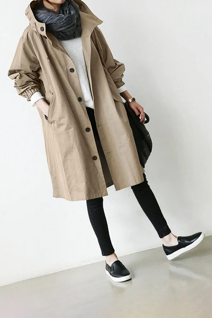 Women's elegant waterproof hooded trench coat, a stylish rain jacket for versatile daily wear and fall outfits.