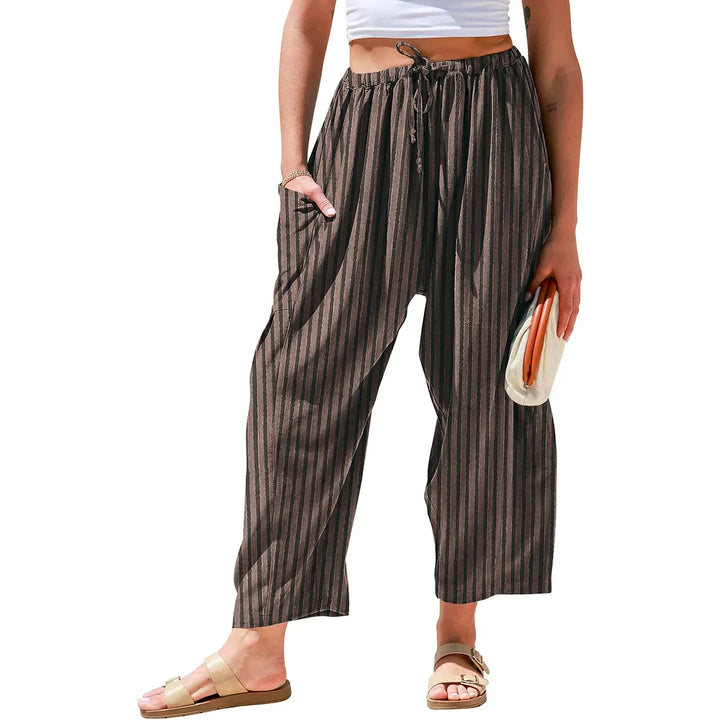 Stylish women's wide-leg striped pants. Perfect comfortable resort wear and vacation apparel.