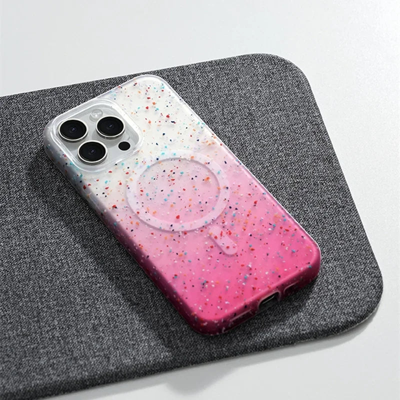 Slim women's iPhone MagSafe case, InkSplash design with vibrant paint splatter, offering full protection.