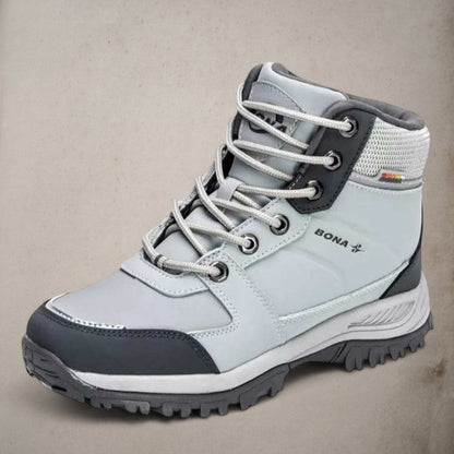Side view of women's insulated hiking boot, showcasing ankle support and protective design