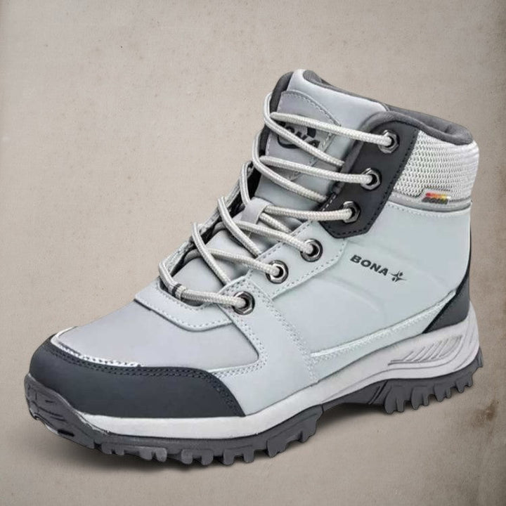 Side view of women's insulated hiking boot, showcasing ankle support and protective design