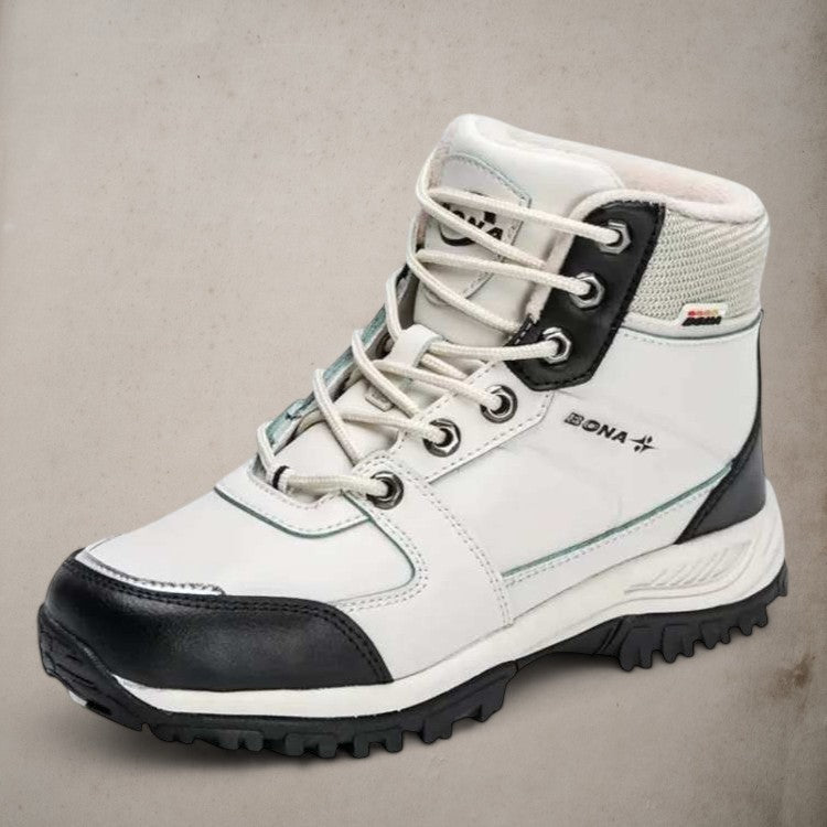 Women's insulated hiking boots in natural outdoor setting, perfect for winter trails