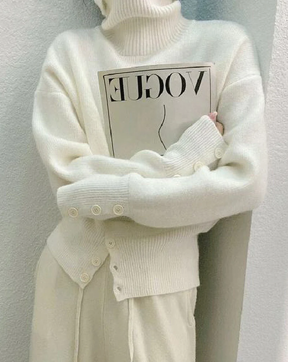 Elegant ivory plain knit turtleneck sweater for women. Soft, cozy, and perfect for fall & winter chic fashion.