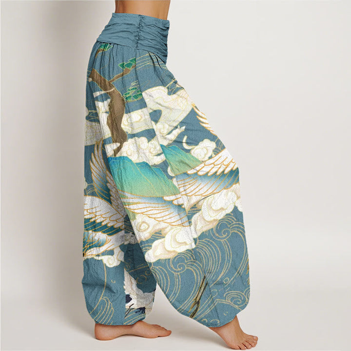 Stylish women's harem pants featuring an elegant Japanese crane art print. Perfect for a relaxed, unique look.