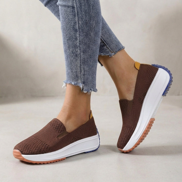 Stylish knit slip-on platform sneakers for women. Features orthopedic support and comfortable design for active wear.