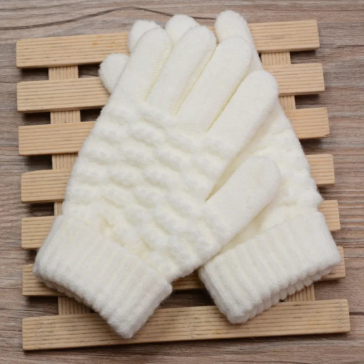 Fashionable women's knitted touchscreen gloves, a winter must-have accessory.