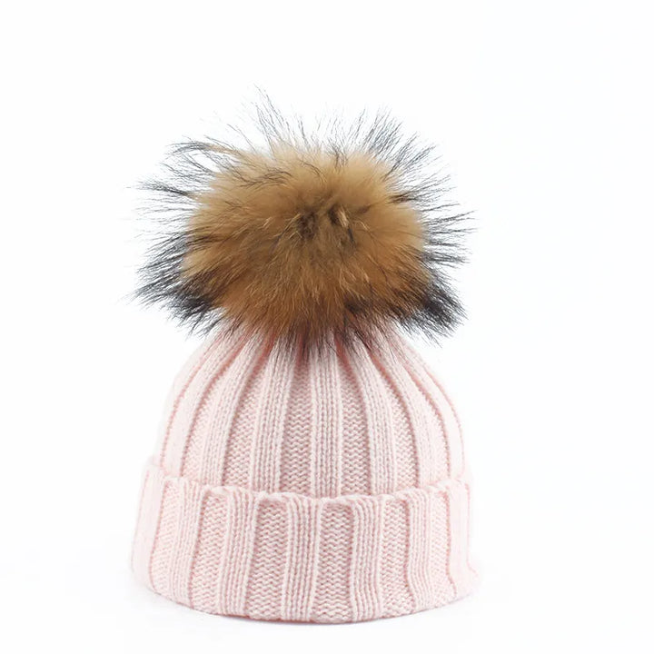 Soft knitted women's winter hat, warm and cozy with a prominent pom-pom. Ideal for cold days.