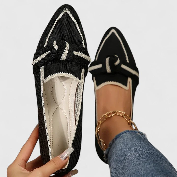 Women's fashion footwear: elegant pointed-toe flat loafers with a decorative knot-front, perfect for everyday chic.