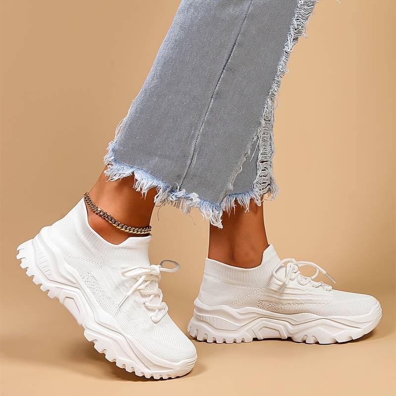 Stylish women's lace-up sneakers with a trendy chunky sole. Versatile casual shoes for modern everyday wear.
