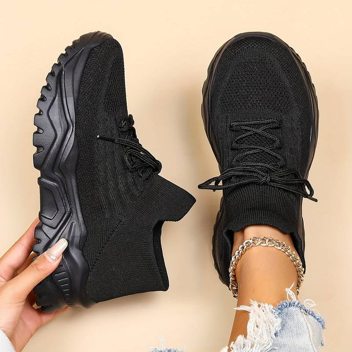 Fashionable women's lace-up casual sneakers featuring a bold chunky sole, ideal for contemporary everyday style.