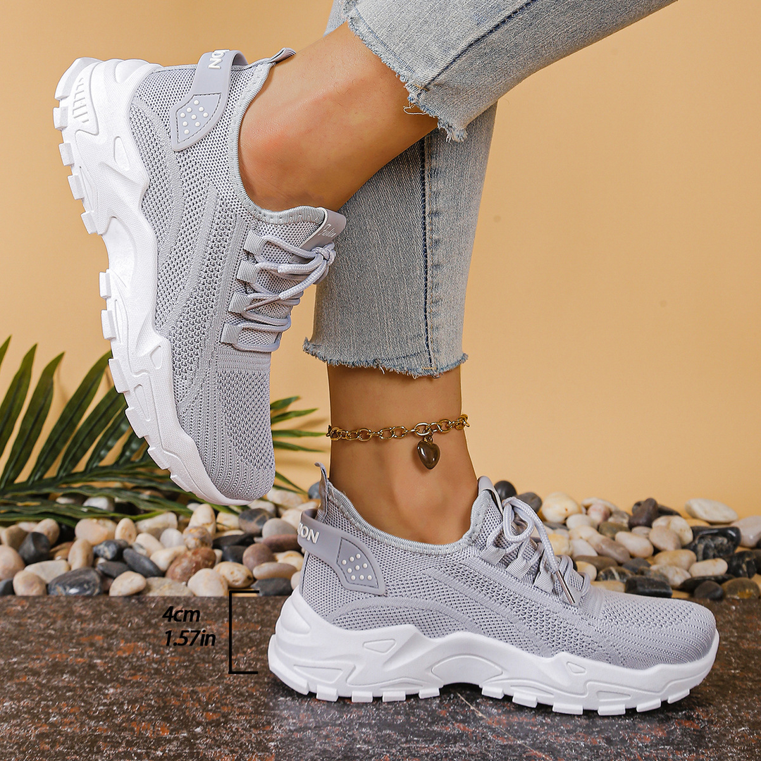 Athletic women's lace-up orthopedic sneakers, providing cushioned support for active lifestyles.