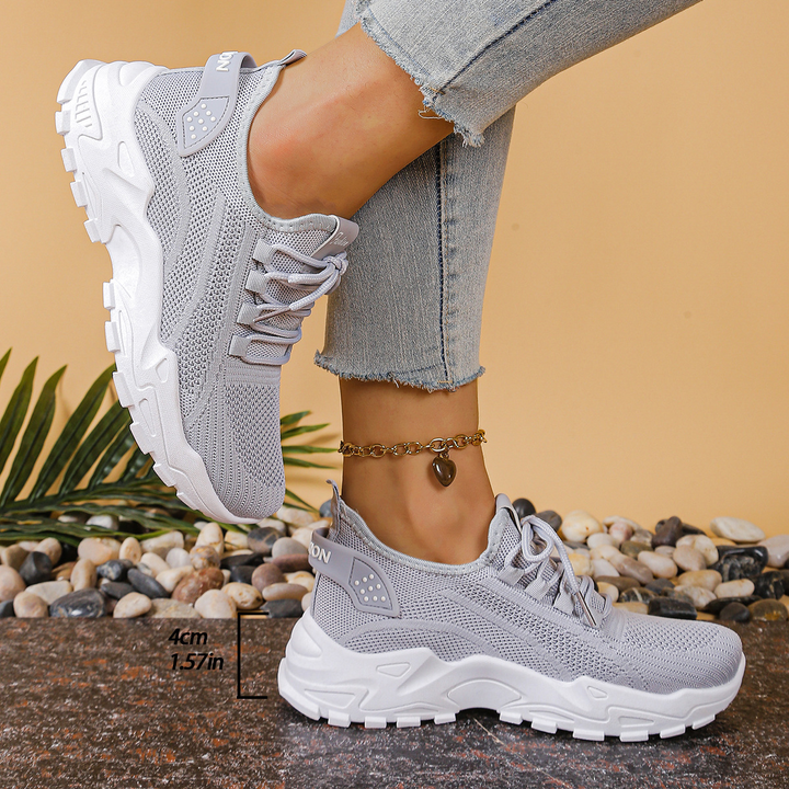 Athletic women's lace-up orthopedic sneakers, providing cushioned support for active lifestyles.