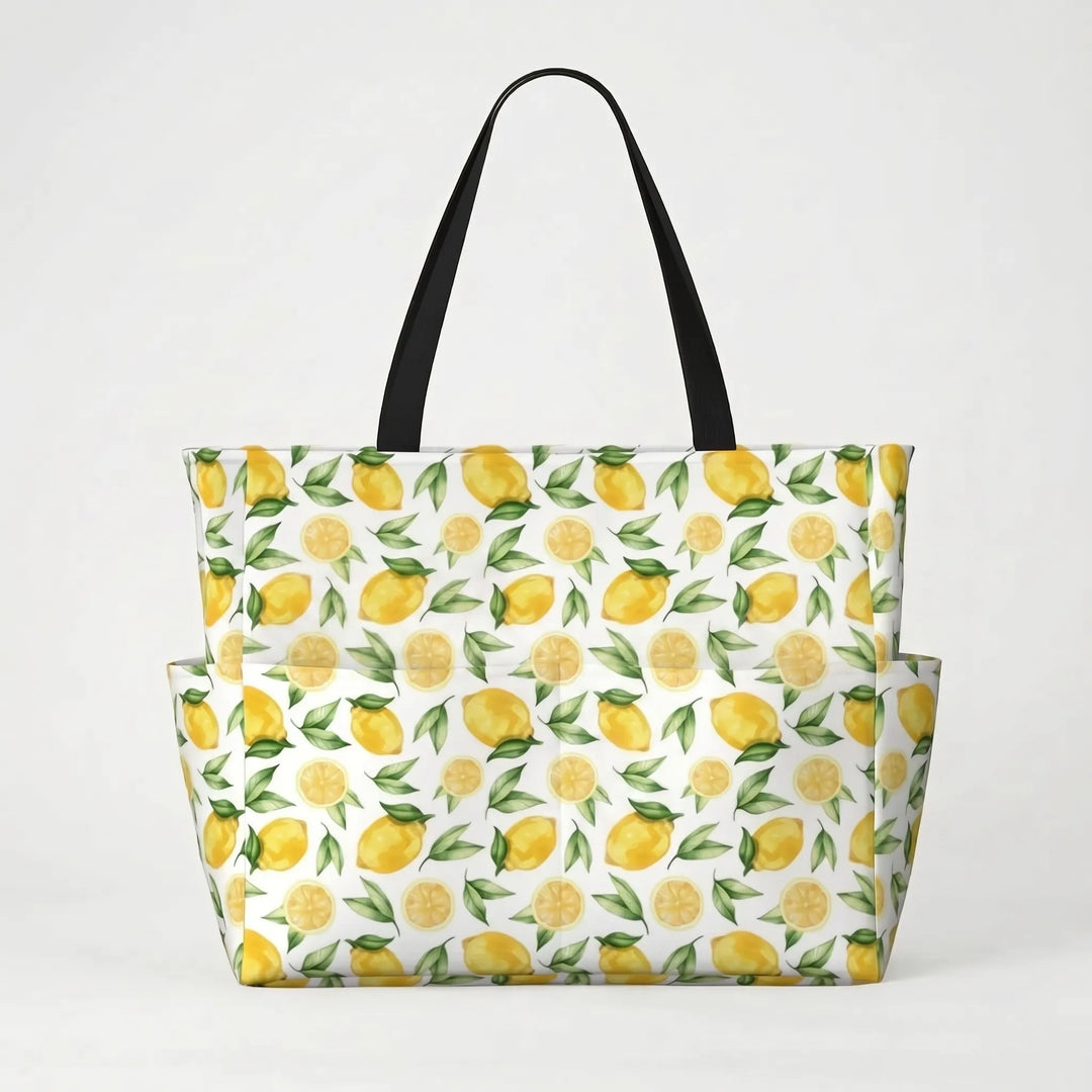 Women's large tropical beach tote bag, perfect for poolside relaxing. Filled with summer essentials. Lemon print.