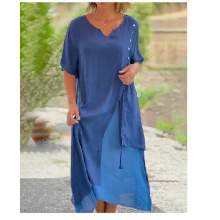 Elegant women's flowy midi dress with V-neck and short sleeves. Ideal for summer and spring fashion.