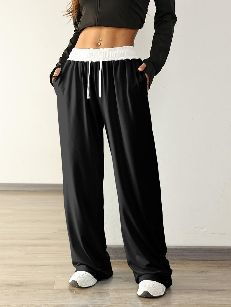 Stylish women's wide-leg sweatpants with a relaxed fit & elastic waist, perfect for athleisure or lounging.