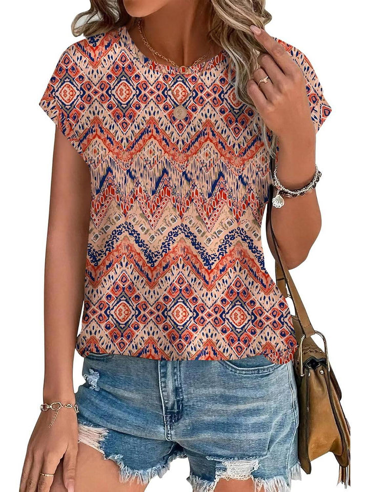 Stylish women's cap sleeve blouse featuring a vibrant watercolor leaf print for spring fashion.