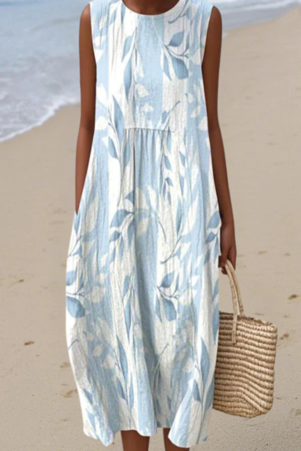 Comfortable women's sleeveless midi dress with a stylish leafy print. Ideal for versatile day or summer wear.
