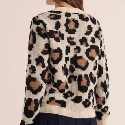 Bold women's leopard print cardigan. Trendy long sleeve outerwear, chic and relaxed fit.