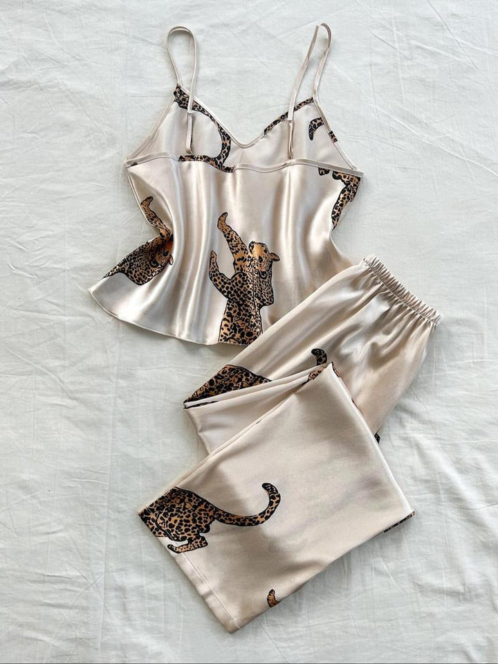Chic women's leopard print silk satin loungewear set. Elegant animal print pajamas for luxury sleep.