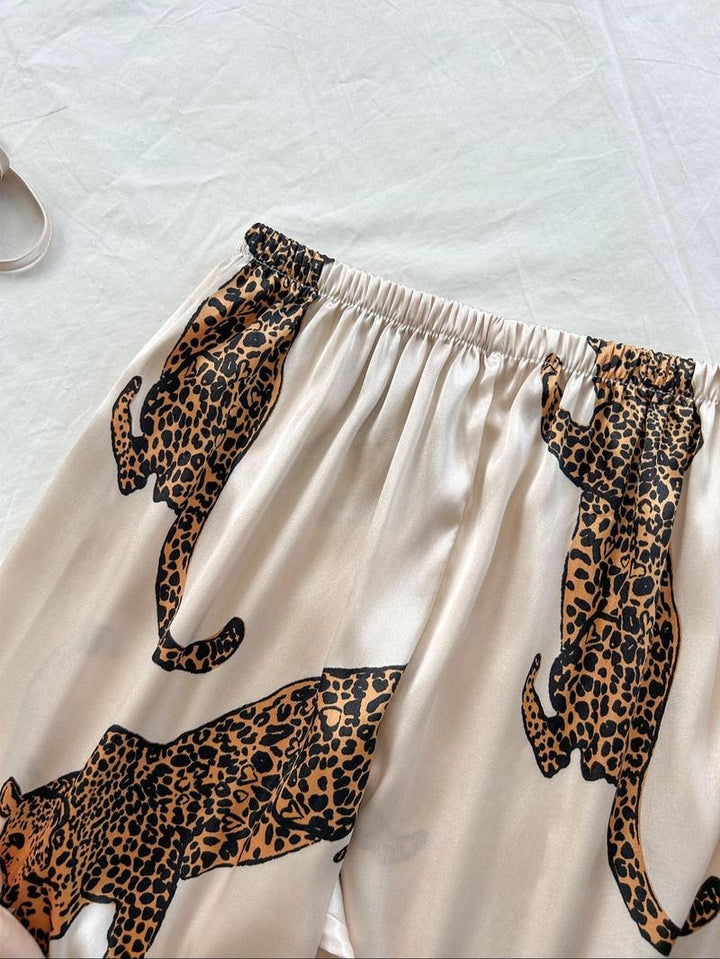 Comfortable women's silk satin leopard print sleepwear set. Soft pajamas for relaxing loungewear.