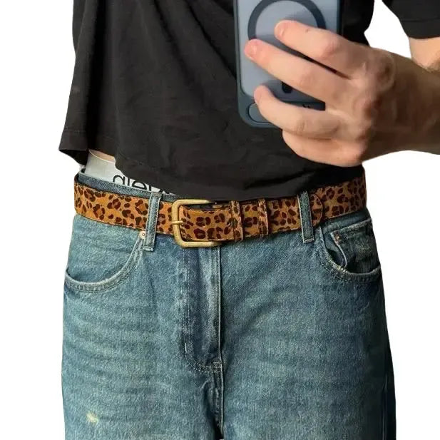 Women's leopard print suede belt, a stylish fashion accessory for confident women. Features an adjustable buckle.