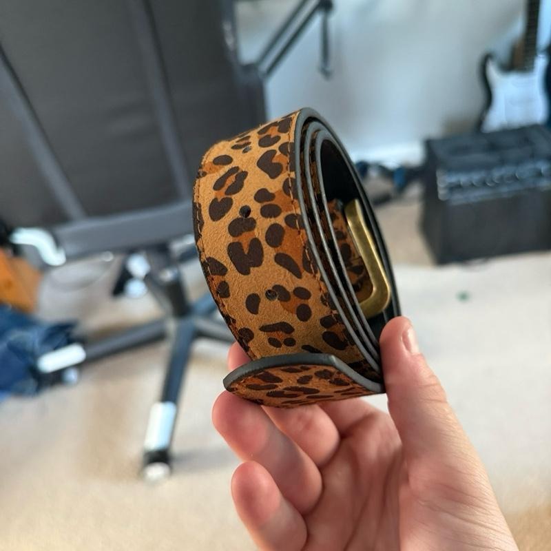 Stylish women's leopard suede waist belt with an eye-catching animal print. Perfect statement fashion accessory.