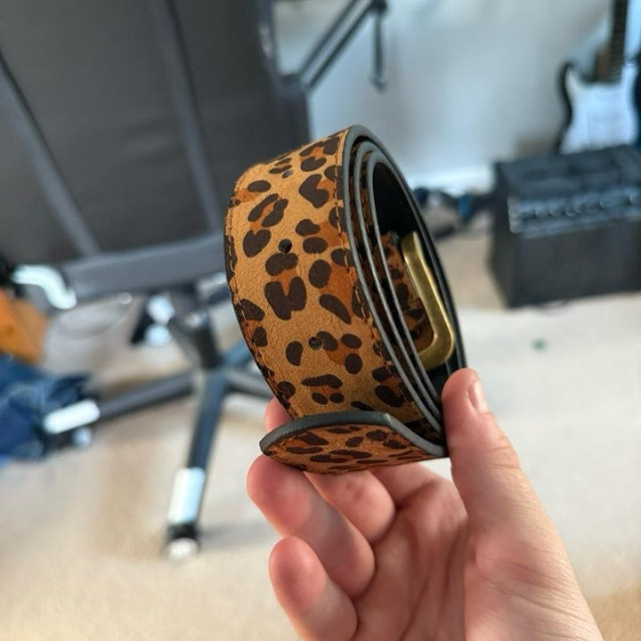 Stylish women's leopard suede waist belt with an eye-catching animal print. Perfect statement fashion accessory.