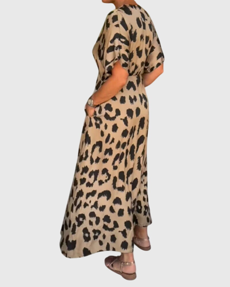 Elegant leopard print V-neck maxi dress for women, featuring a full button front and a flattering flowy cut.
