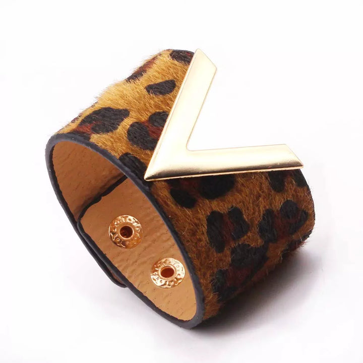 Stylish women's adjustable animal print leather wrap bracelet. Fashion-forward leopard jewelry.