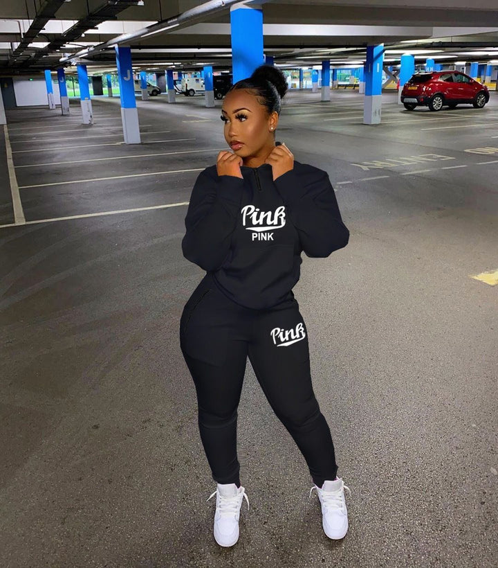 Casual women's two-piece outfit with letter print top and joggers, ideal for loungewear.