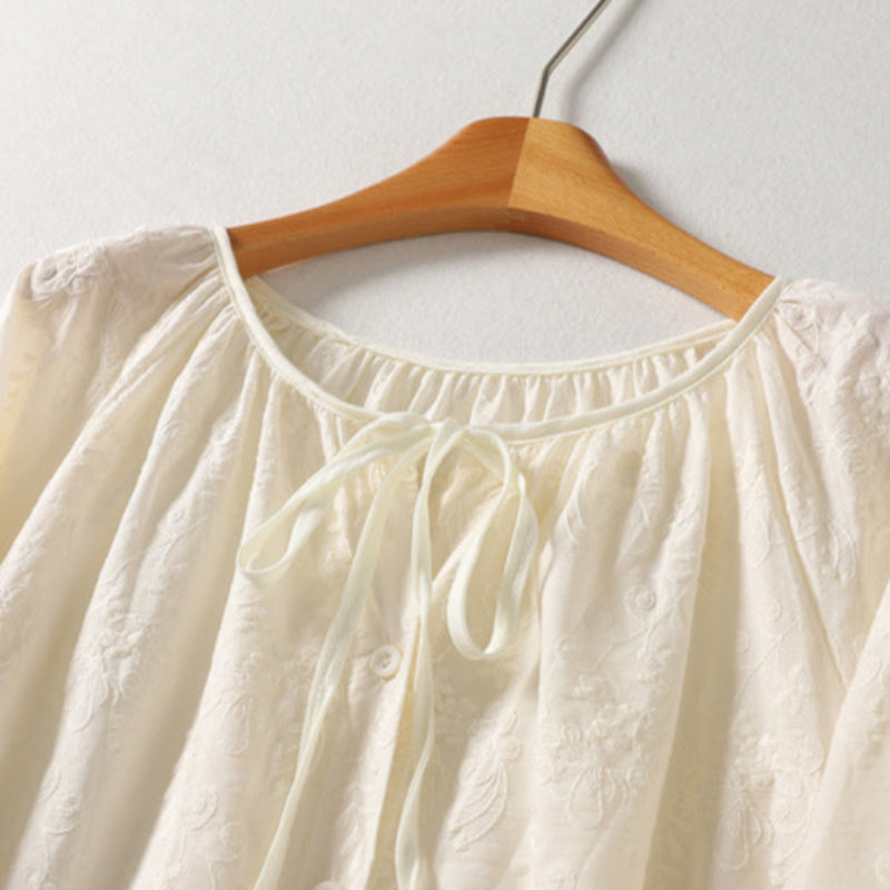 Comfortable Lia women's blouse with delicate embroidery & tie neck. Versatile, soft, and lightweight for spring/summer.