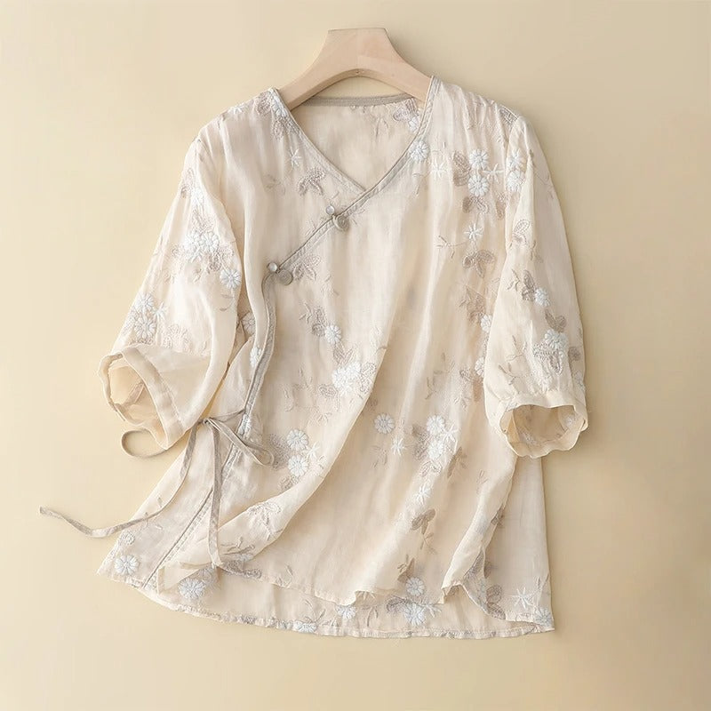 Women's light beige embroidered asymmetrical blouse. Flowy long sleeve top with vintage bohemian style.
