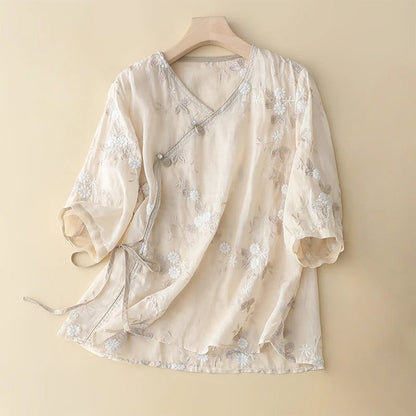 Women's light beige embroidered asymmetrical blouse. Flowy long sleeve top with vintage bohemian style.