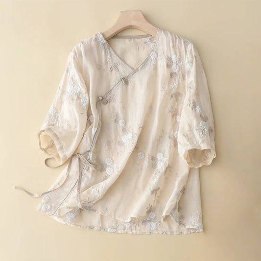 Women's light beige embroidered asymmetrical blouse. Flowy long sleeve top with vintage bohemian style.
