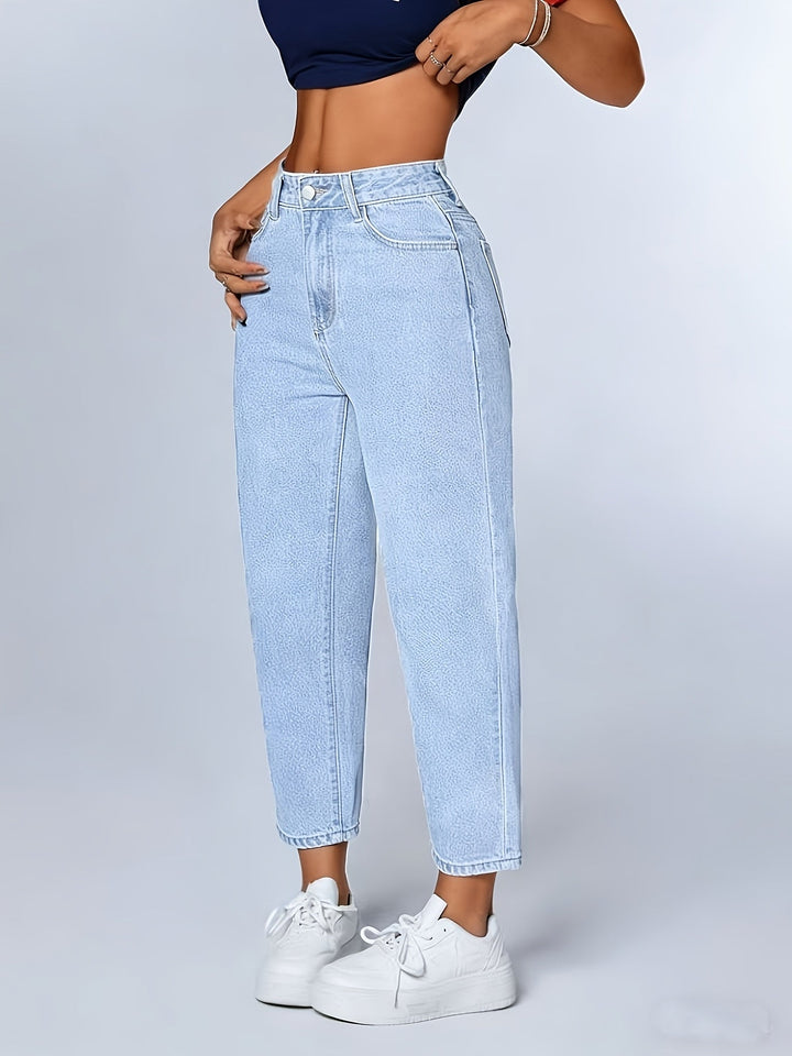 Comfortable women's light blue mom jeans. High-waisted, relaxed fit denim with a stylish tapered & cuffed leg.