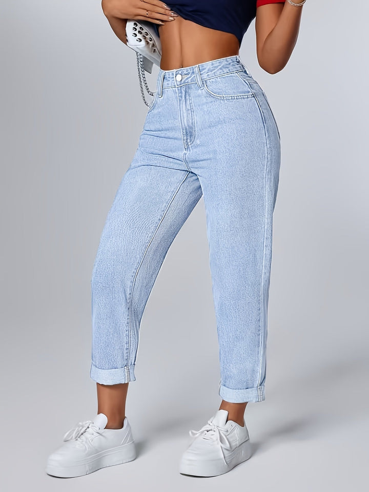 Light blue high-waisted mom jeans for women. Features a relaxed fit, tapered leg, and trendy cuffed hem.