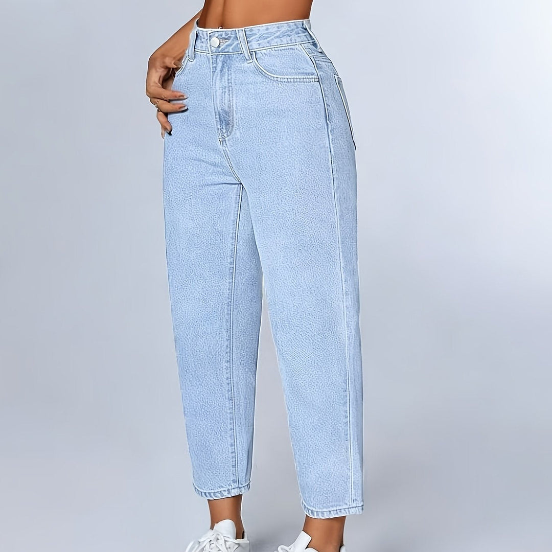Light blue women's mom jeans, relaxed high waist fit. Tapered leg denim with a comfortable cuffed hem.