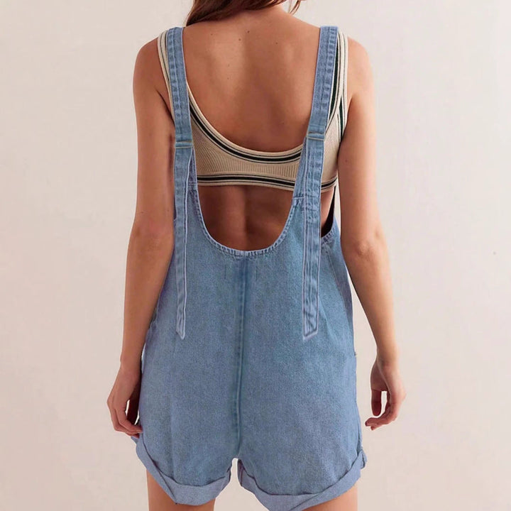 Sleeveless denim romper for women featuring front pockets, a versatile light blue casual outfit for summer fashion.