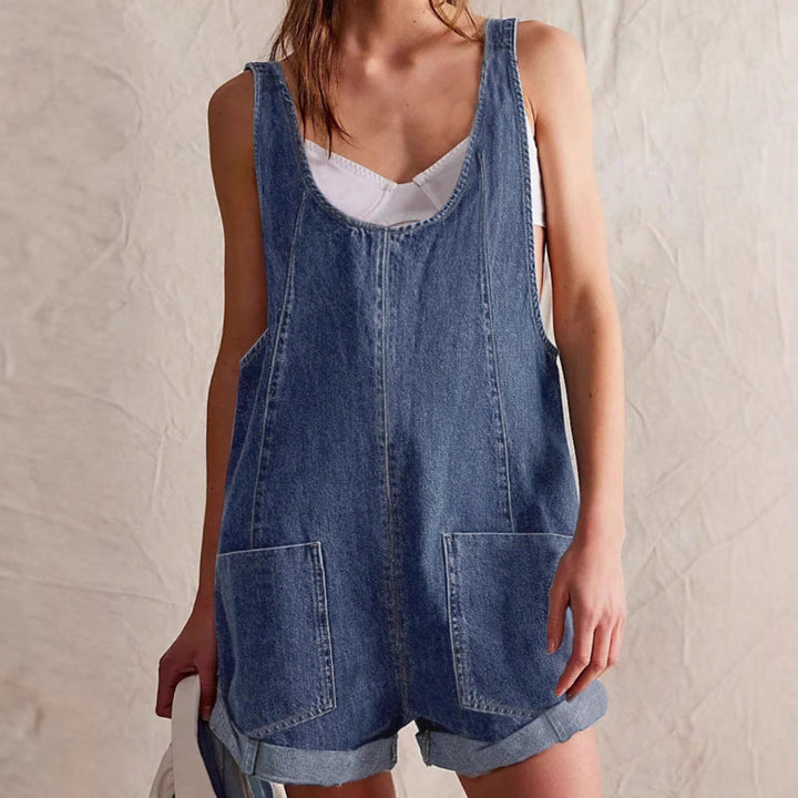 Chic women's denim romper with sleeveless design & pockets. A flattering one-piece shorts outfit for summer fashion.