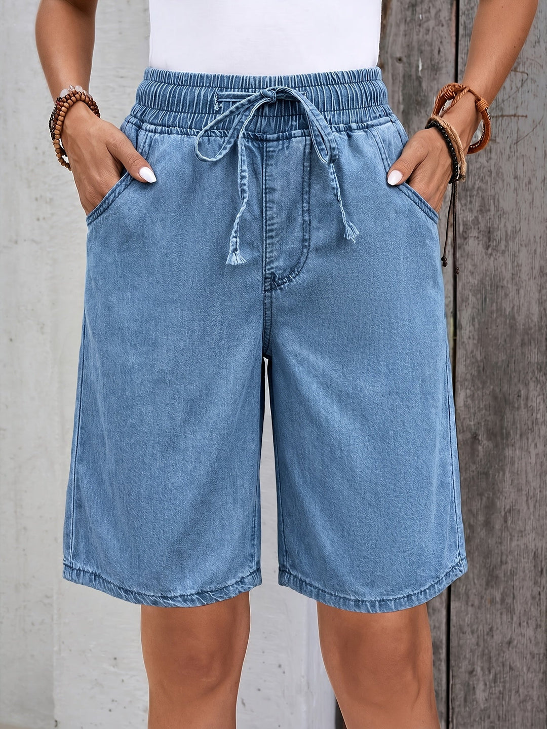 Women's light blue wide leg Bermuda shorts with a comfortable drawstring waist, perfect for casual summer wear.