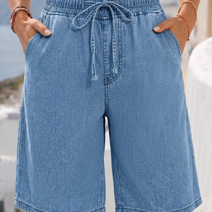 Casual light blue women's wide leg Bermuda shorts with a drawstring waist, a summer wardrobe essential.