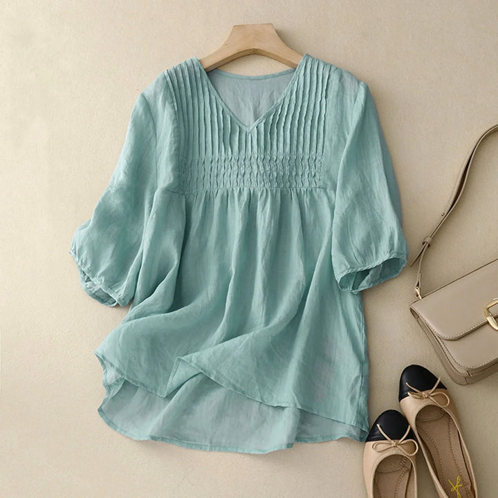 Comfortable long-sleeve women's button-up shirt, lightweight & breathable for versatile casual wear.