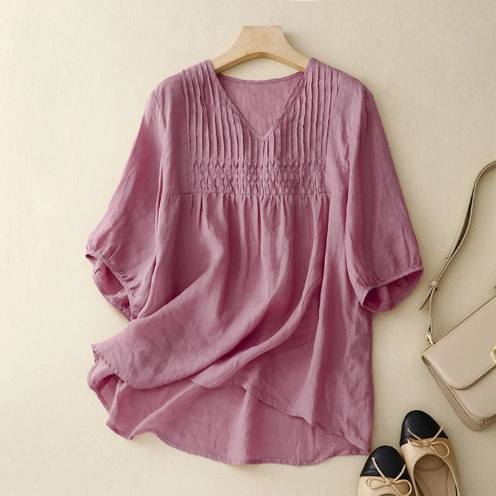 Casual women's lightweight button-up shirt, breathable and comfortable for everyday summer style.