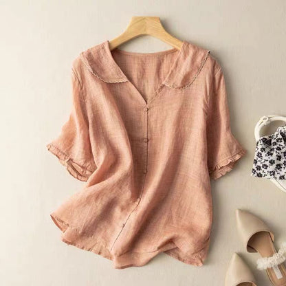 Elegant women's breezy blouse, lightweight and comfortable, featuring a stylish scalloped collar. Versatile summer top.