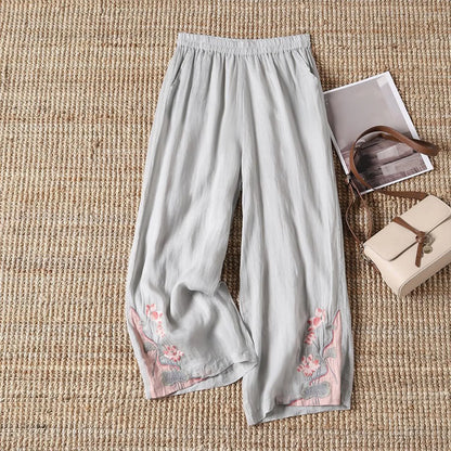 Versatile women's summer trousers featuring a delicate floral print, made from soft, breathable cotton.