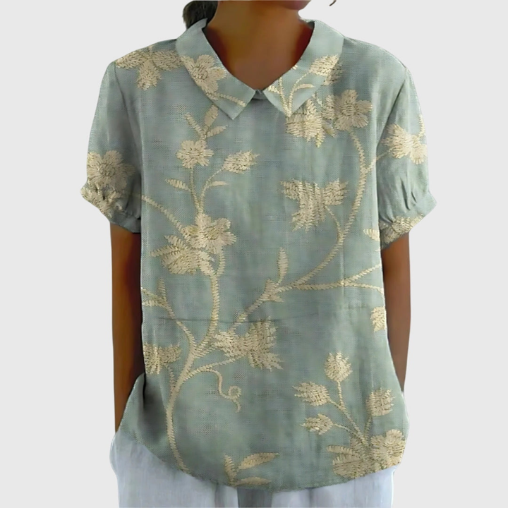 Women's collared floral blouse, a short sleeve relaxed fit top for effortless summer elegance.