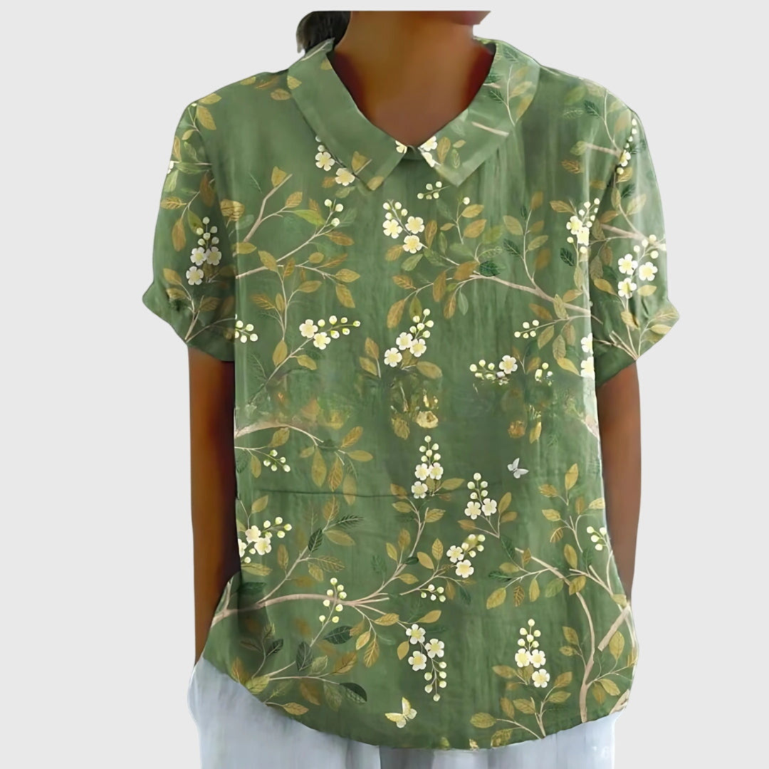 Casual women's summer blouse with a charming floral print and comfortable short sleeves.
